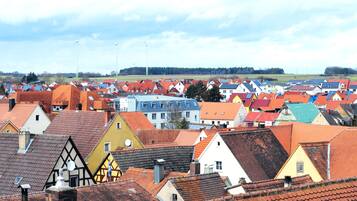 A town with colorful buildings, some with solar panels.