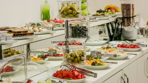 A buffet with various food items and utensils. - Beyzas Hotel & Suites (Istanbul)