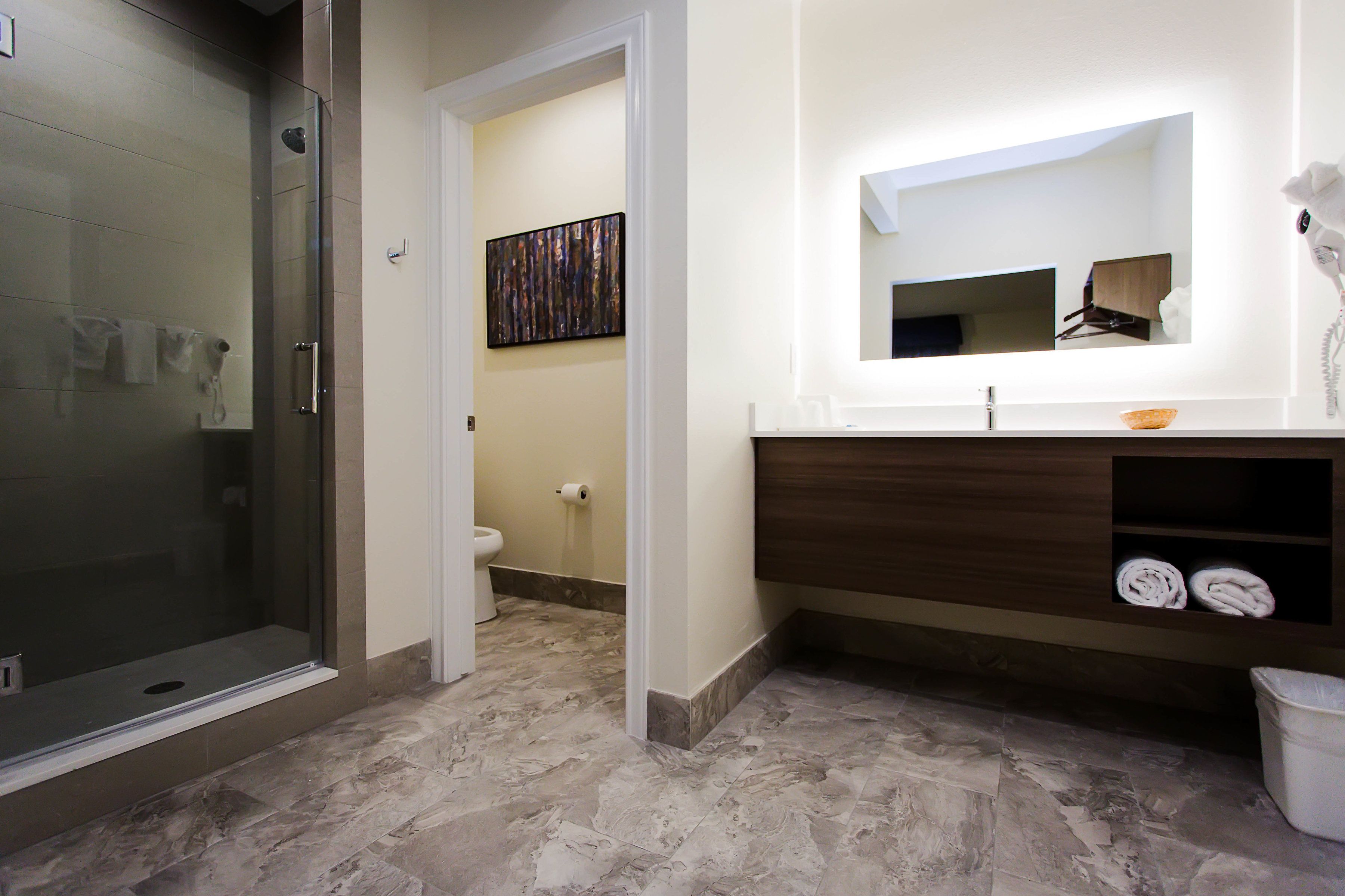 Designer toiletries, hair dryer, towels