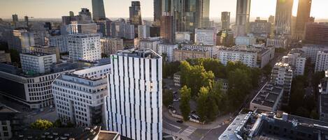 Experience the vibrant cityscape with a mix of modern skyscrapers and traditional buildings.