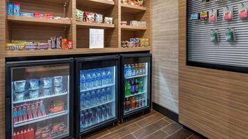 A refrigerated display case with snacks and beverages.
