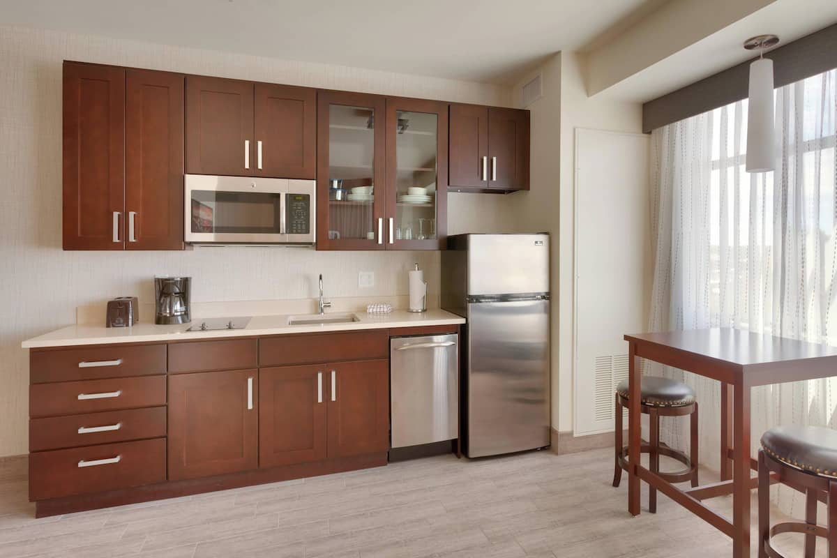 executive studio, 1 king bed | private kitchen | full-sized fridge, microwave, stovetop, dishwasher
