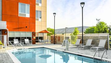 Seasonal outdoor pool, open 9:00 AM to 10:00 PM, pool umbrellas