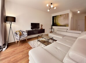 Deluxe Apartment, 2 Bedrooms, City View | Living area | Flat-screen TV