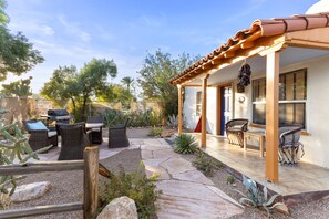 A patio with outdoor furniture, a pergola, and a variety of plants. - Quintessential Midtown Bungalow   (Tucson)