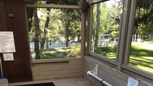 A hot tub with a warning sign and a sign for ski hill guests. - Best Location in Town -- One Block to Main St. & Close to the Slopes and Gondola (Breckenridge)