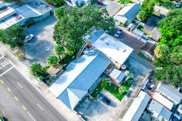 An aerial view of a residential area with houses, a school, and a parking lot.