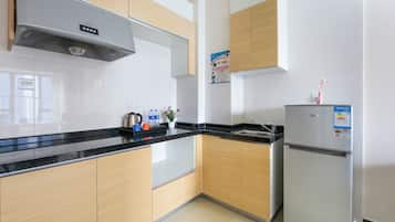 Fridge, microwave, electric kettle, dining tables