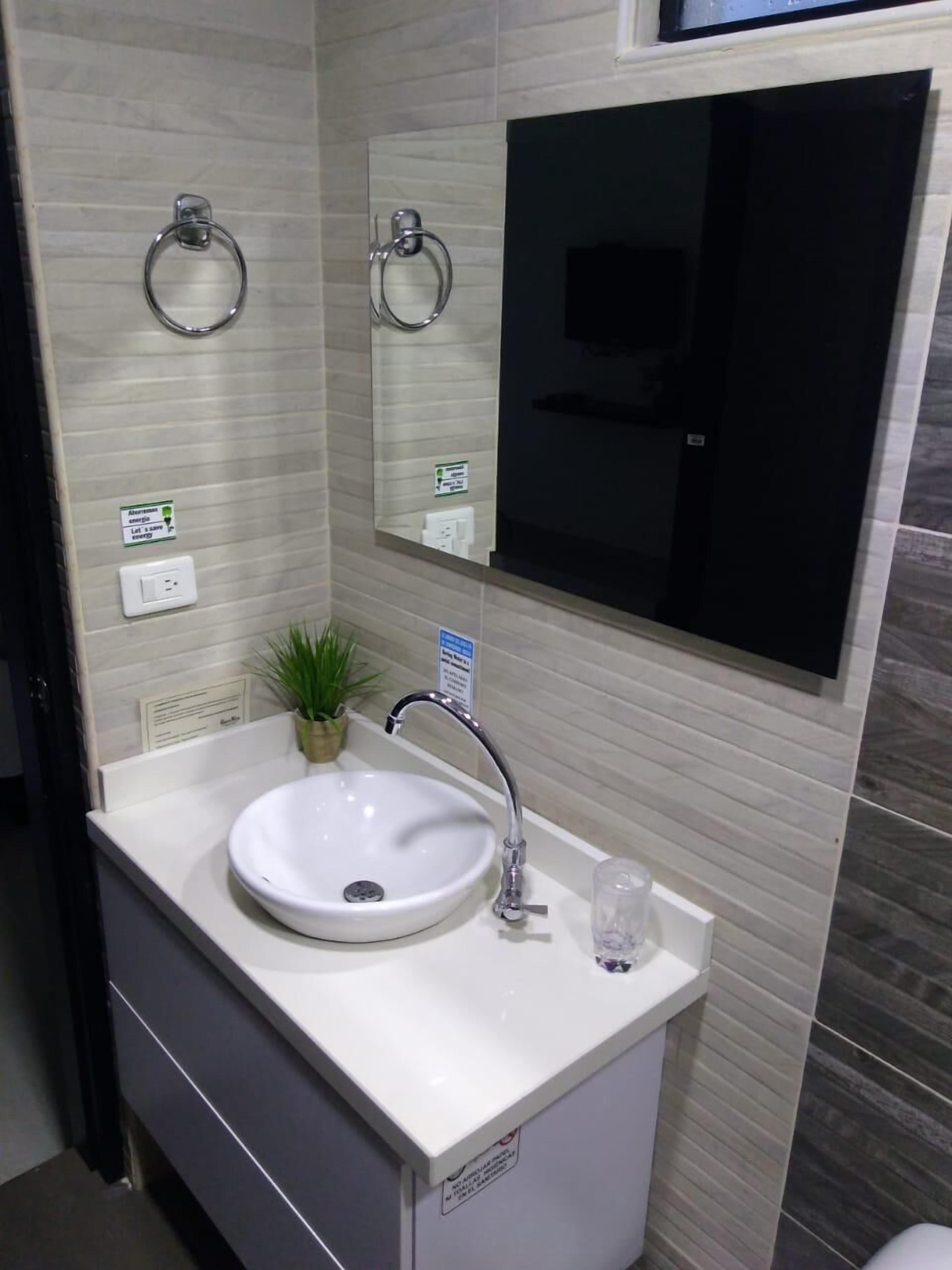 exclusive apartment, refrigerator & microwave, pool view | bathroom | free toiletries, towels