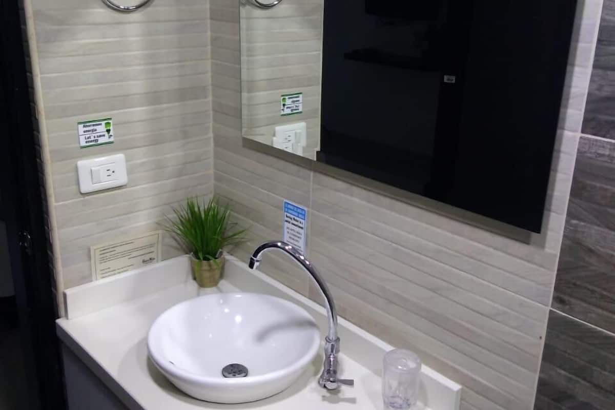 exclusive apartment, refrigerator & microwave, pool view | bathroom | free toiletries, towels