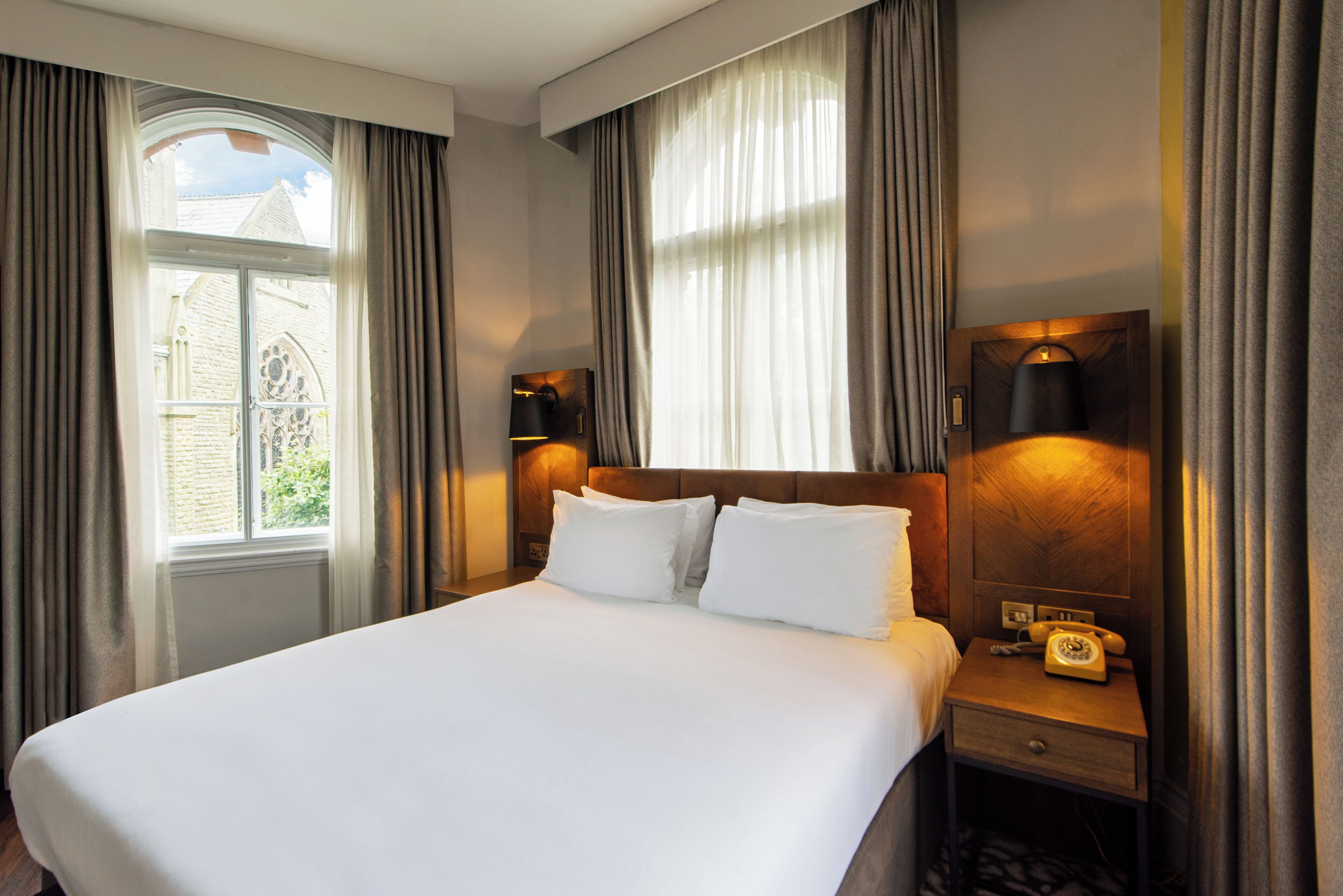 premium room, 1 king bed (methodist church view) | 1 bedroom, free minibar items, in-room safe, individually decorated