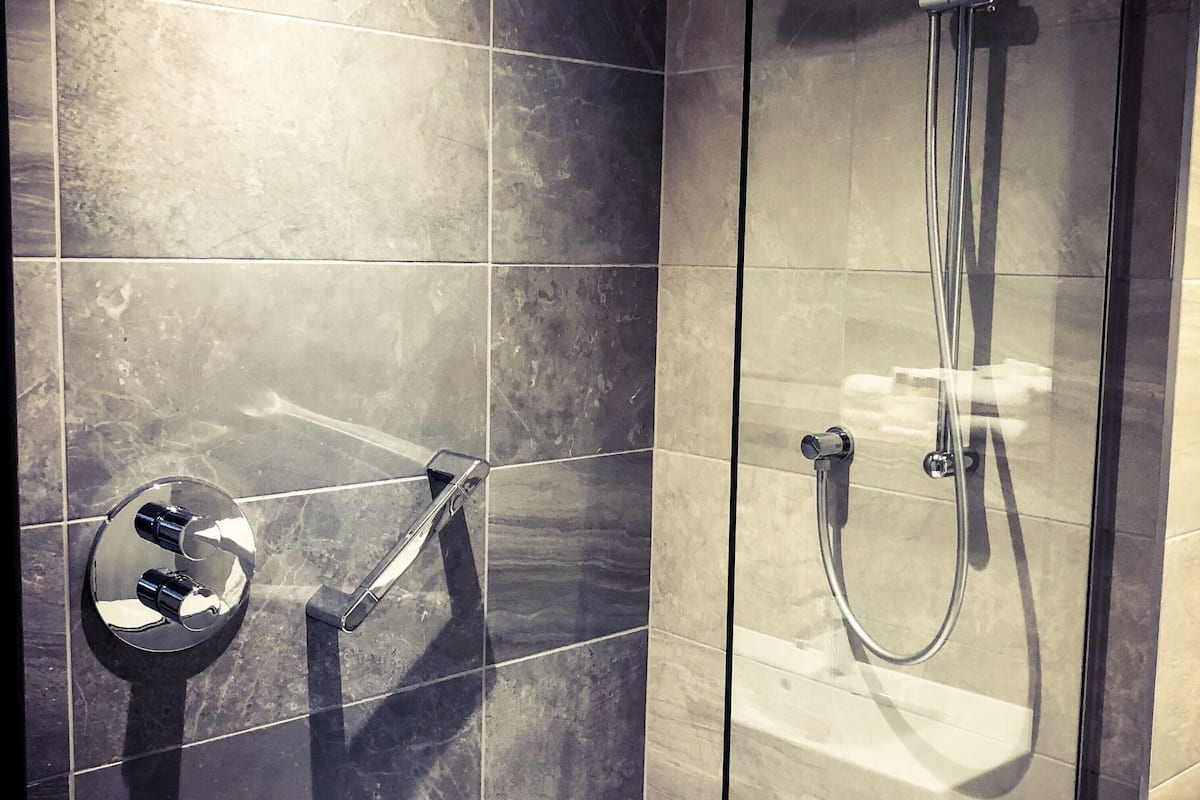 designer toiletries, hair dryer, towels