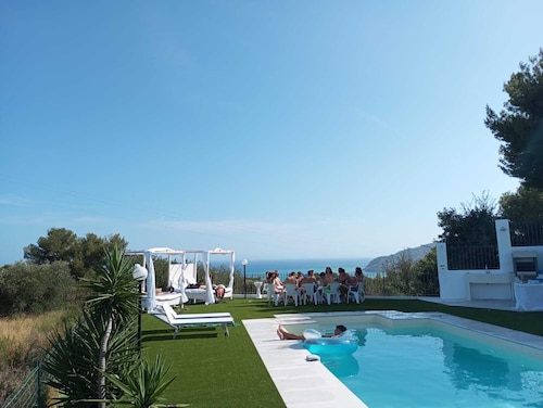 Villa surrounded by greenery with sea view and swimming pool