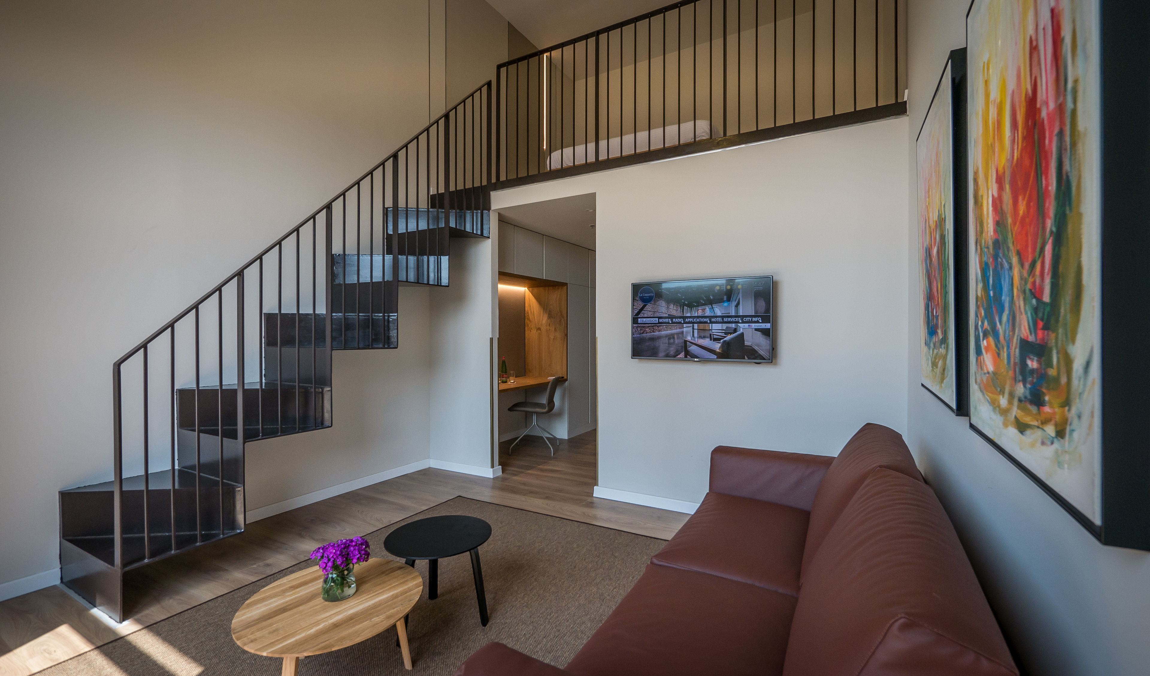 deluxe suite, balcony | living area | flat-screen tv