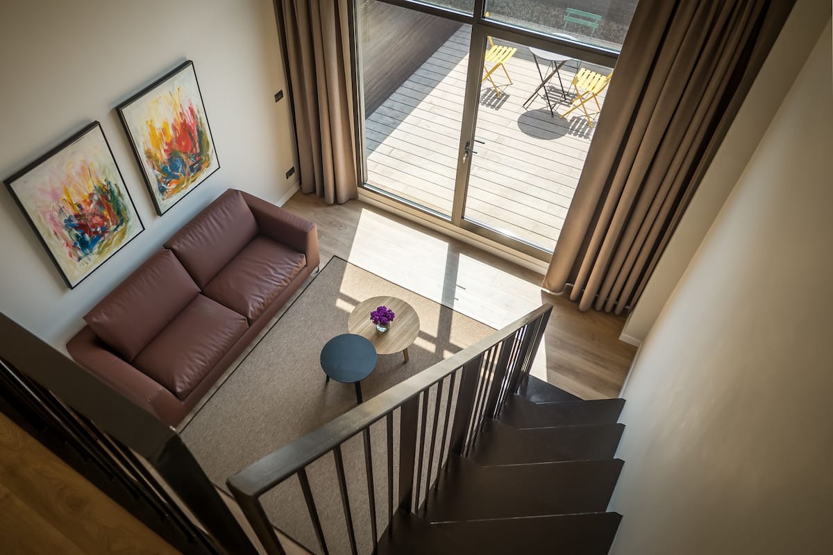 Deluxe Suite, Balcony | Living area | Flat-screen TV