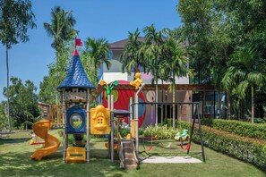 A playground with slides, swings, and climbing structures.
