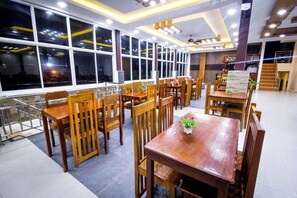 Breakfast, lunch, dinner served; local cuisine 