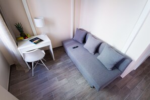 Family Double Room | Living area | 25-inch flat-screen TV with digital channels, TV