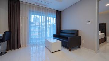 Chambre Double Deluxe | Coin séjour | Chauffage par le sol