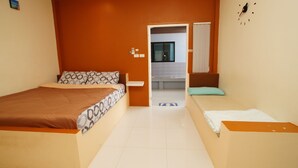 A hotel room with two beds, a bathroom visible through an open door, and a clock on the wall. - Baan Samart 2 Pool Villa Hua Hin (Hua Hin)