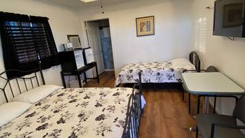 Deluxe-værelse til 3 personer (Deluxe Room One Queen, One Single) | Individuelt design, individuel indretning, lydisolering, gratis Wi-Fi