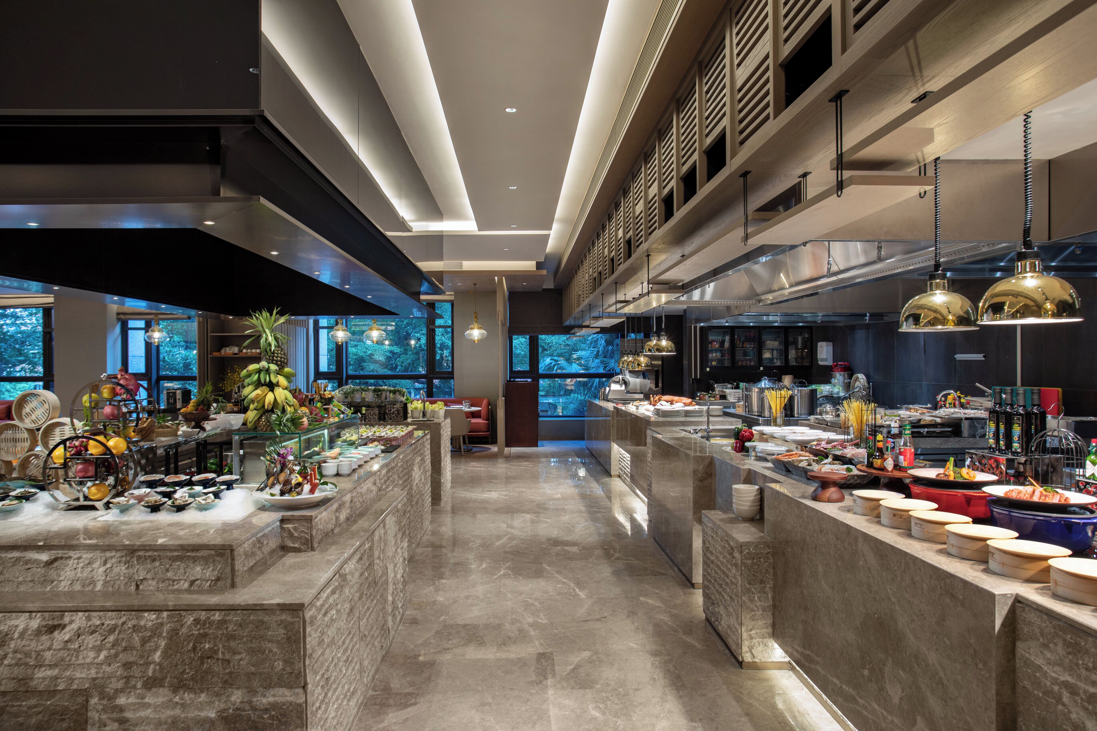 A modern kitchen with a central island, ample counter space, and a view of the outdoors.