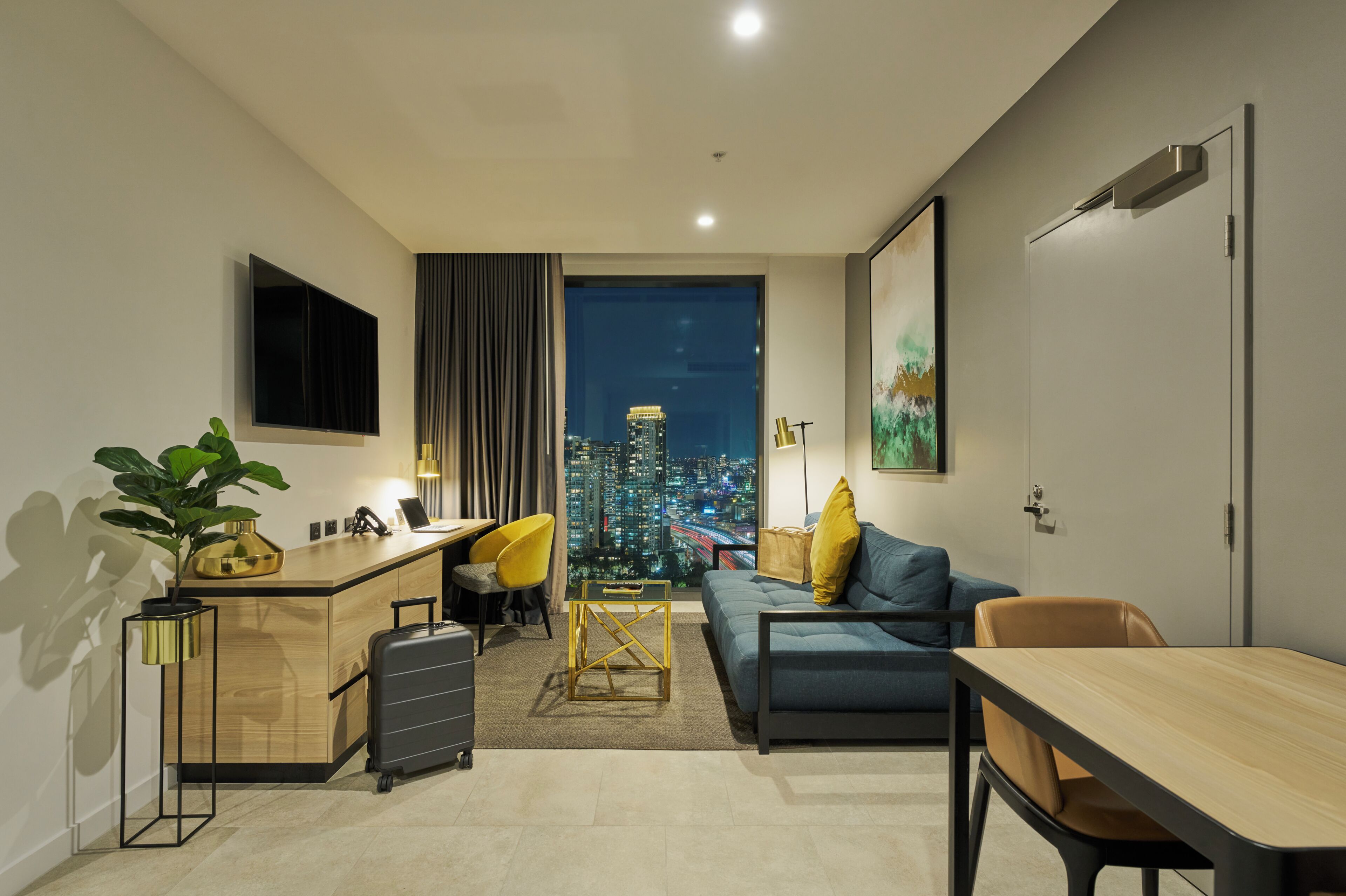 Suite, 1 Bedroom, City View | Living area | 50-inch LED TV with cable channels, TV, pay films