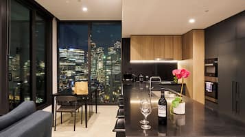 Deluxe Apartment, 2 Bedrooms, City View | Living area | 50-inch LED TV with cable channels, TV, pay films