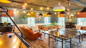 A room with a pool table, a ping pong table, a piano, and a billiards table. - The Knoll House (Swanage)