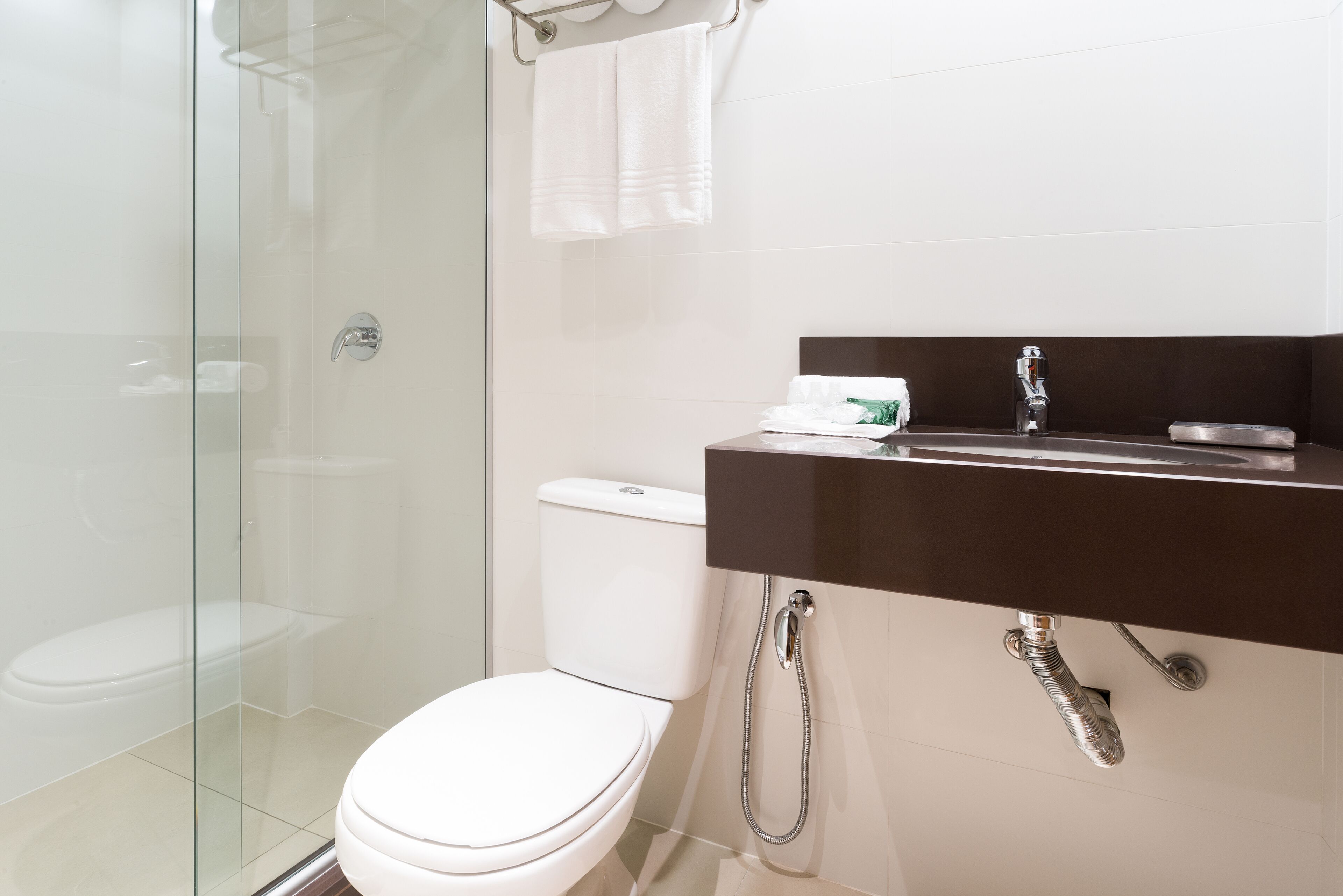 deluxe room | bathroom | shower, designer toiletries, hair dryer, towels