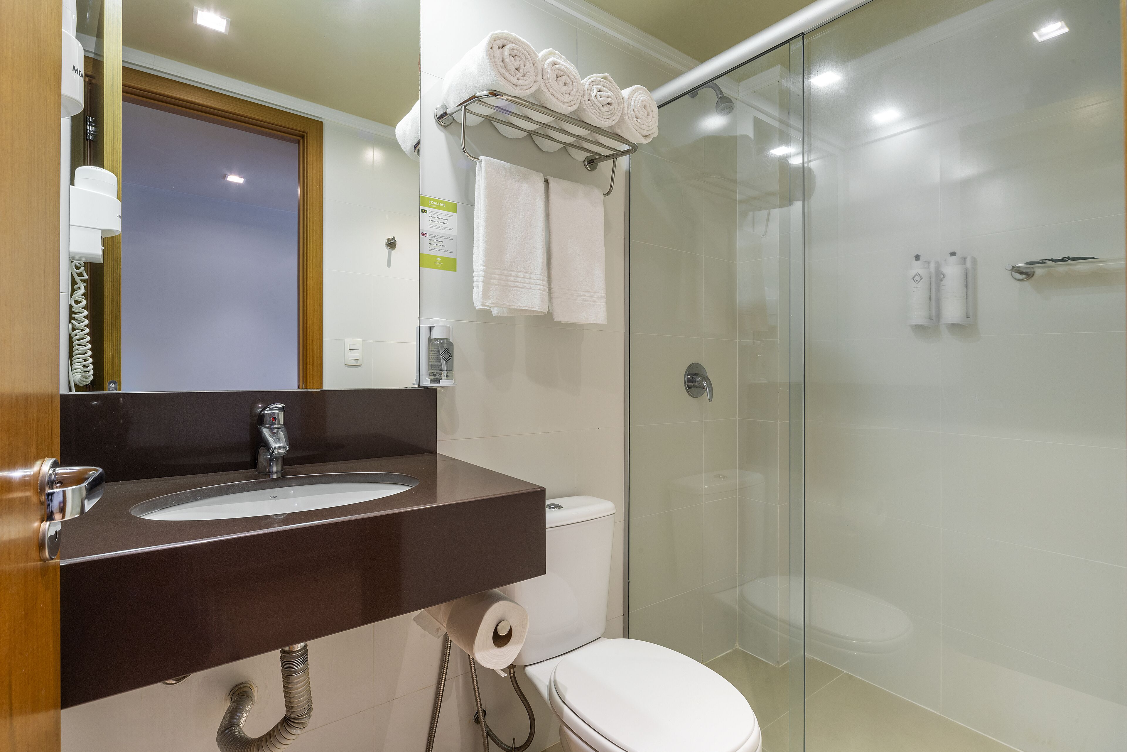 shower, designer toiletries, hair dryer, towels