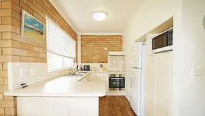 2 Bedroom Unit with Large Fenced Yard  | Private kitchen - Beachcomber Pet Friendly (Merimbula)