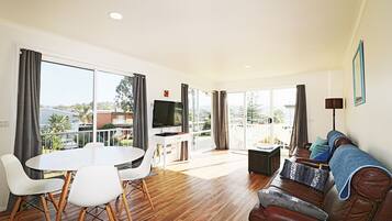 Exclusive Apartment, 2 Bedrooms, Accessible, Lake View | Living room | Flat-screen TV, DVD player