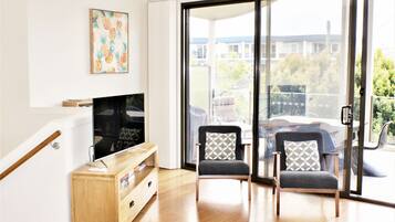 Apartemen, 3 kamar tidur | Area keluarga | TV layar datar dan pemutar DVD