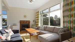 3 Bedroom House | Living room | Flat-screen TV, DVD player - The 50's Beach House (Merimbula)