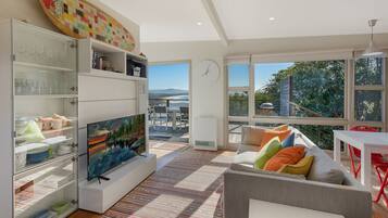 Apartment, 1 Bedroom, Ocean View | Living area | Flat-screen TV, DVD player