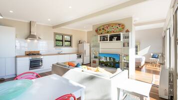 Apartment, 1 Bedroom, Ocean View | Living room | Flat-screen TV, DVD player