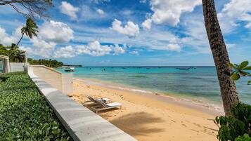 On the beach, sun loungers, beach towels