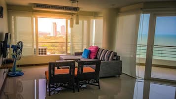 2-Bedroom Condo  | Living room | 32-inch flat-screen TV with cable channels, TV