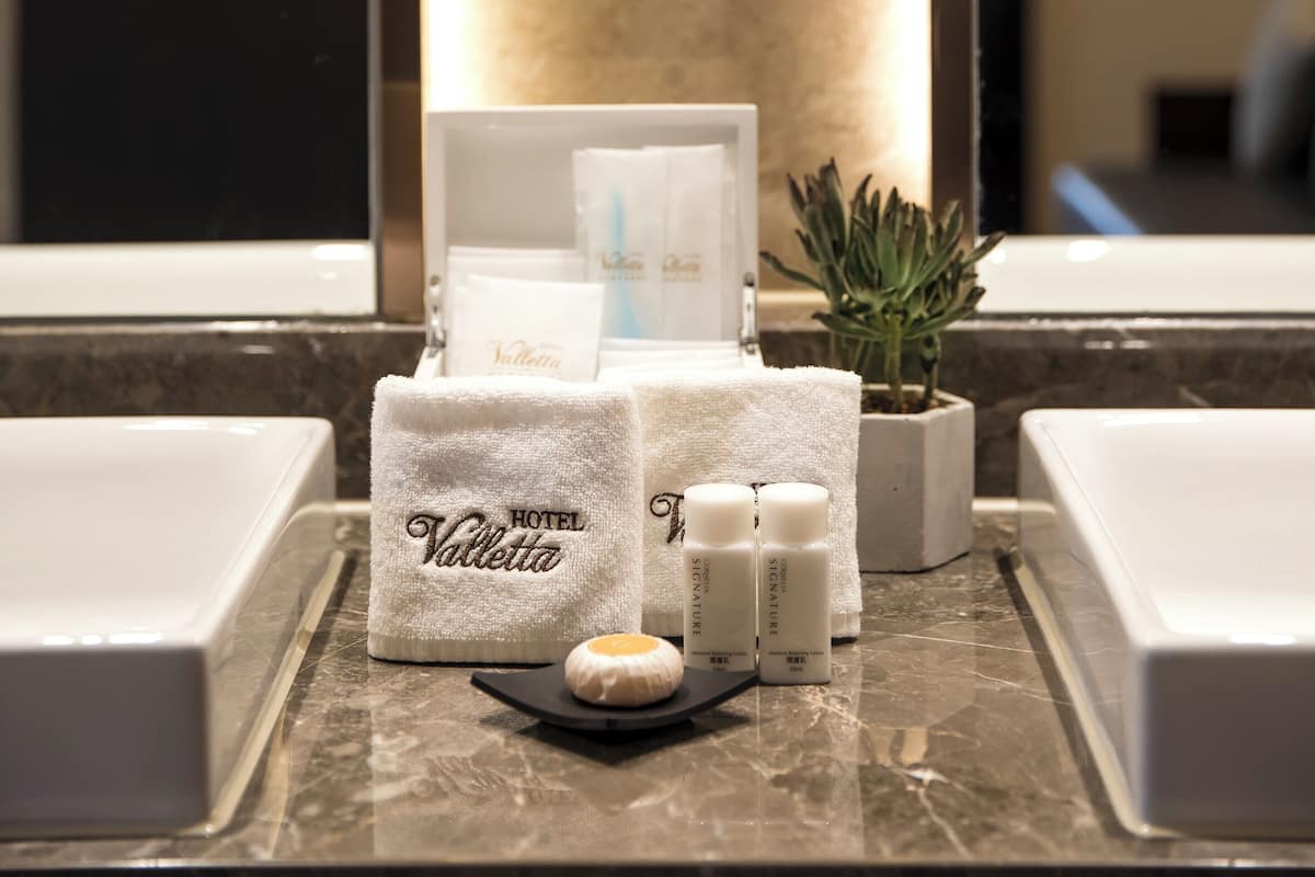 valletta suite | bathroom | separate bathtub and shower, spring water bathtub, hair dryer, bathrobes