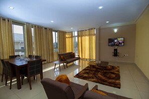Apartment, 3 Bedrooms | Living area | Flat-screen TV