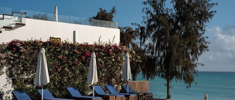 2 outdoor pools, open 7:00 AM to 8:00 PM, pool umbrellas, pool loungers