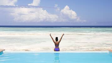 2 outdoor pools, open 7:00 AM to 8:00 PM, pool umbrellas, pool loungers