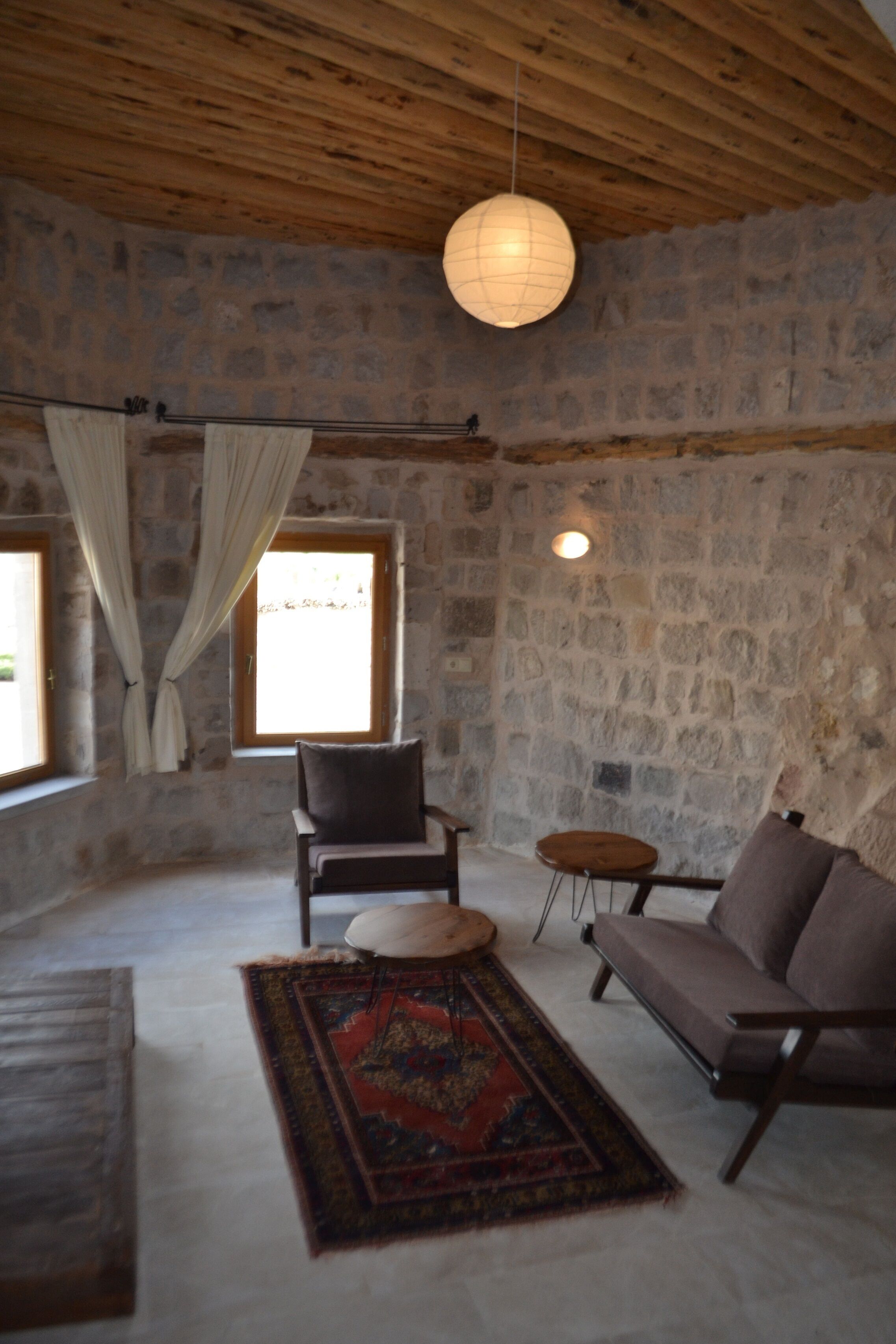 junior suite, 1 king bed, non smoking, garden view | living room | heated floors