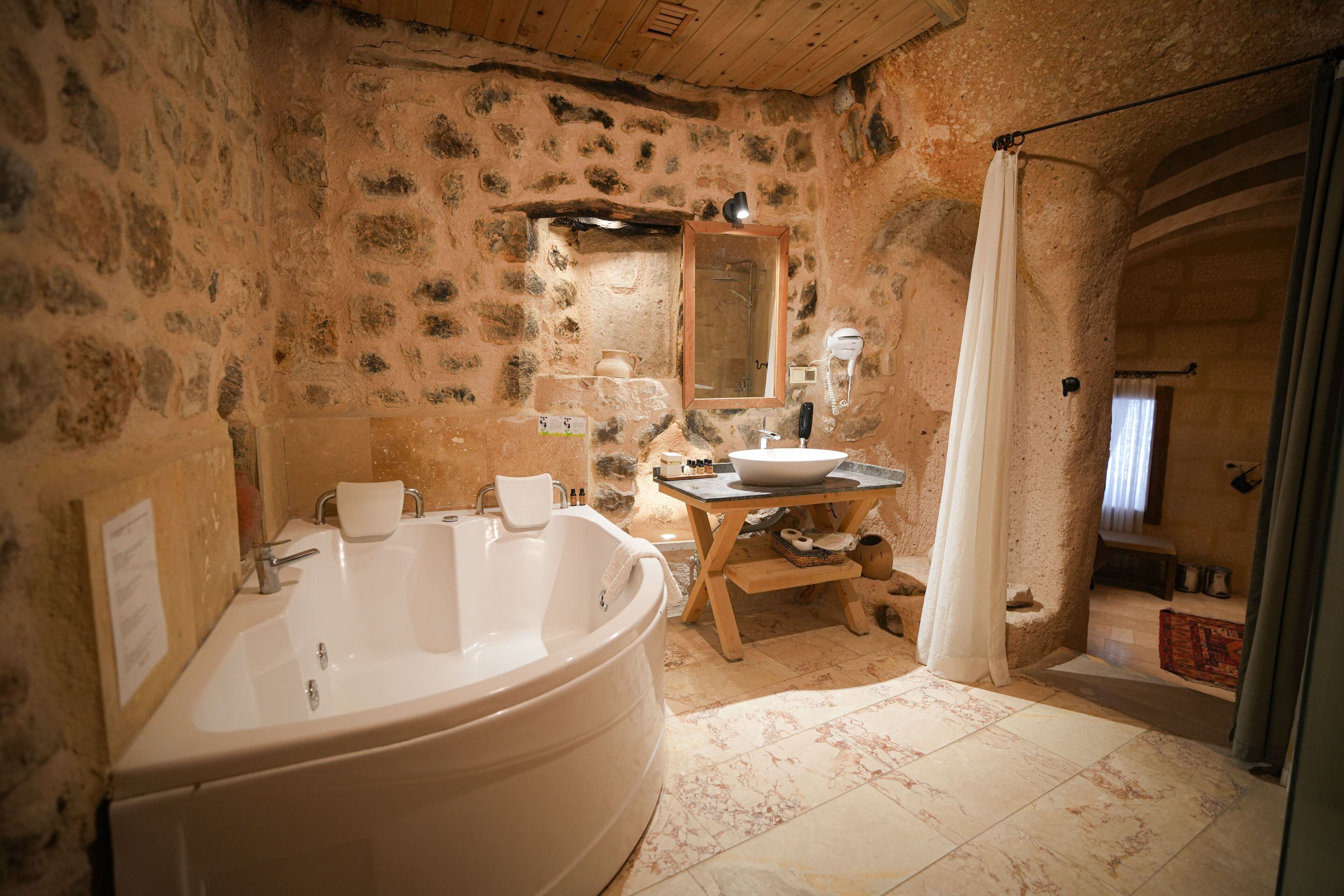 Superior Cave Suites Room | Bathroom | Eco-friendly toiletries, hair dryer, bathrobes, slippers