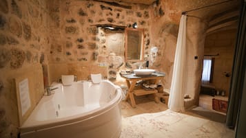 Superior Cave Suites Room | Bathroom | Eco-friendly toiletries, hair dryer, bathrobes, slippers