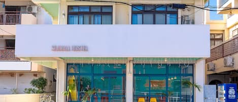 A hostel with a sign reading "SEA WALL HOSTEL".
