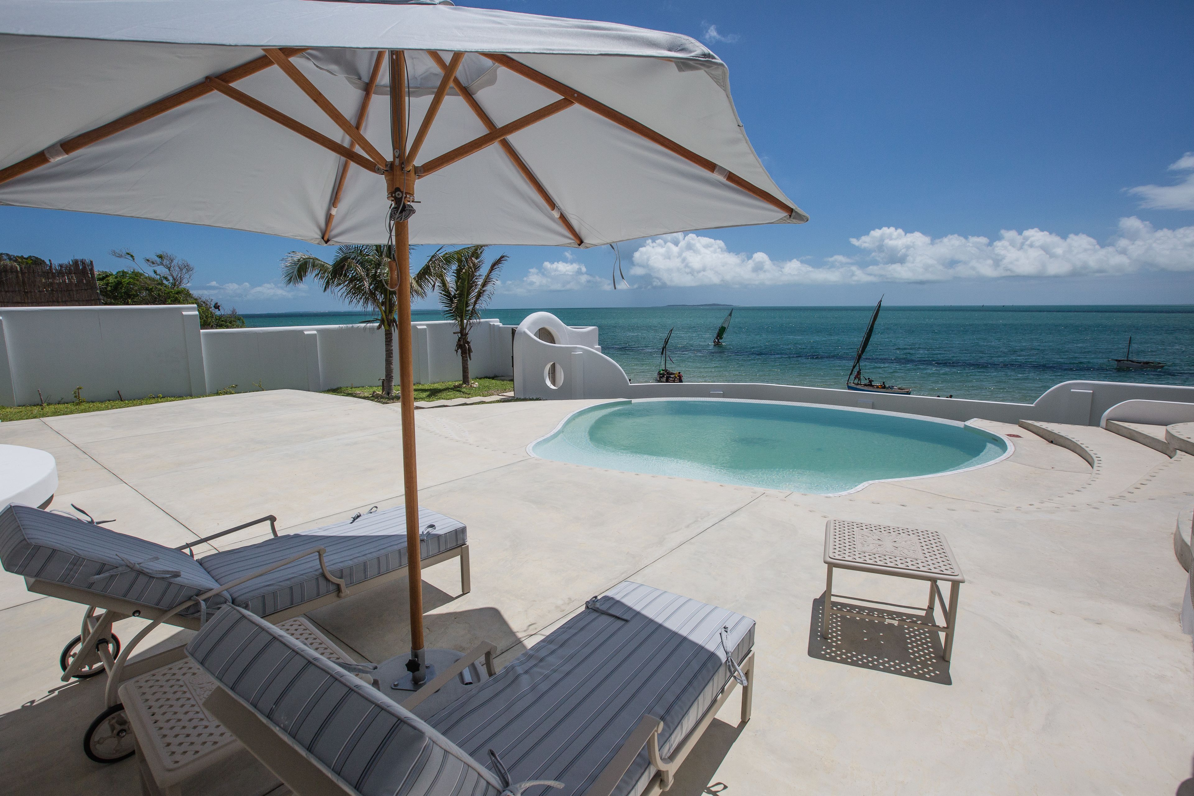 Outdoor pool, pool umbrellas, pool loungers