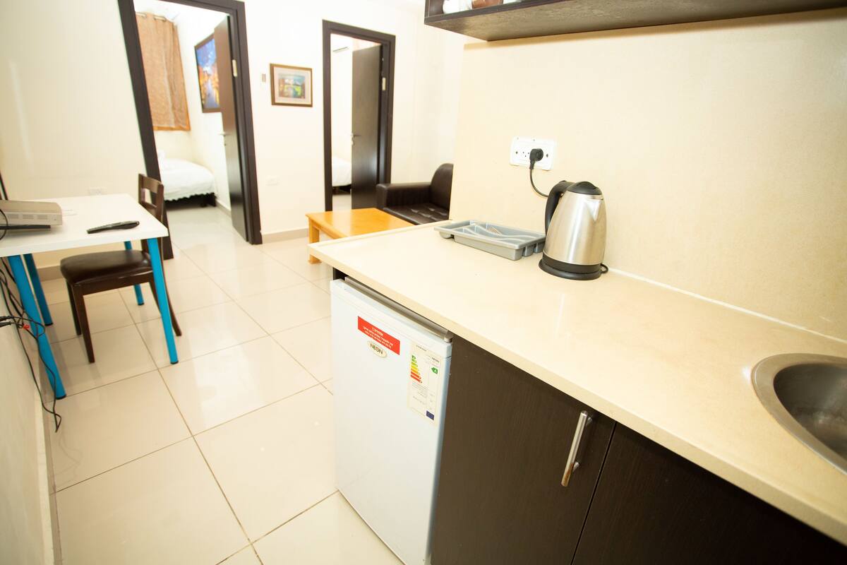 Apartment, 2 Bedrooms, City View | Living room | Flat-screen TV