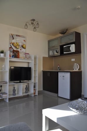 Penthouse exclusivo, 1 cama Queen size, vista a la ciudad | Servicios de la habitación